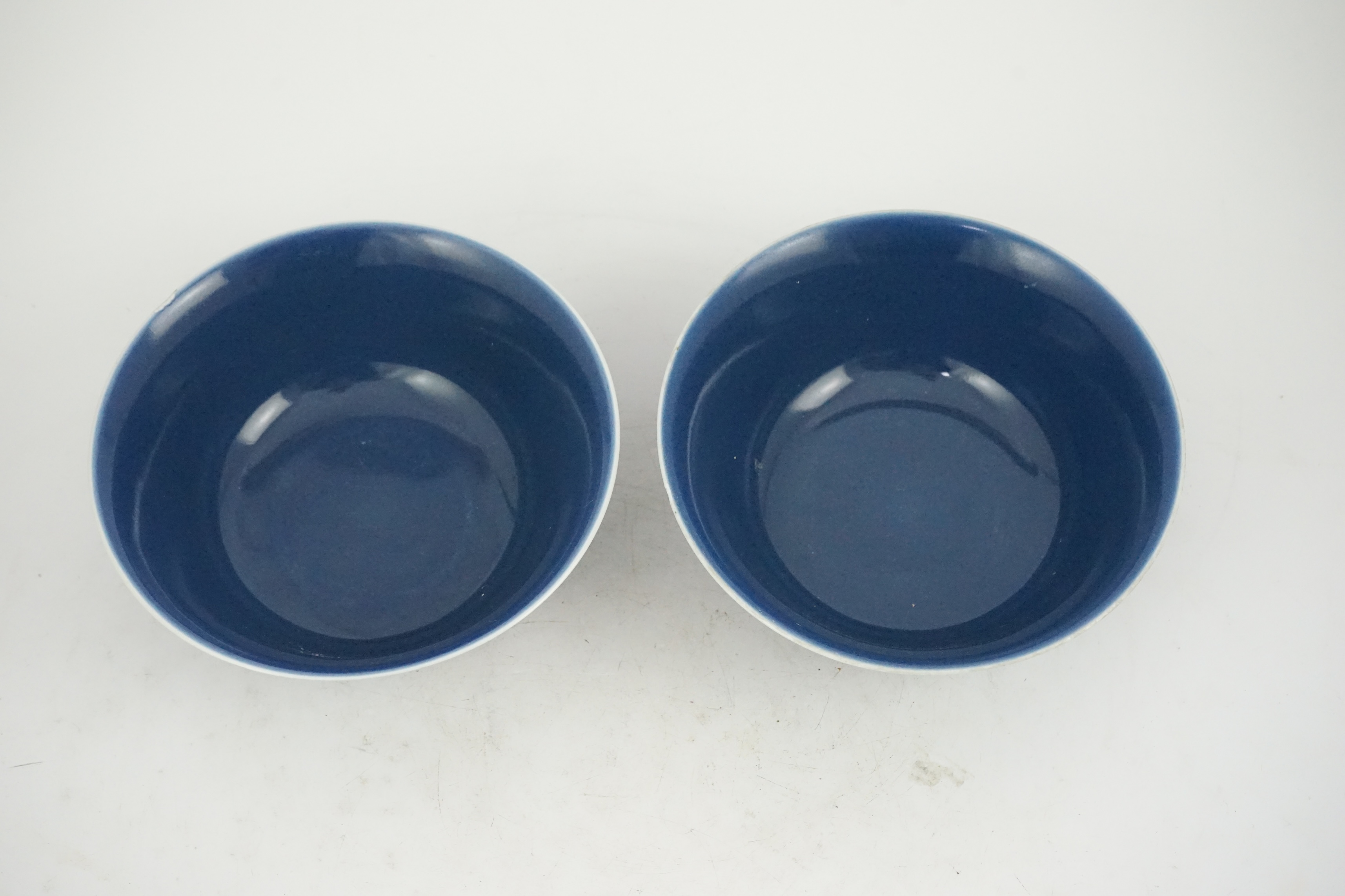 A pair of Chinese powder blue glazed bowls, Daoguang mark and of the period (1821-50)